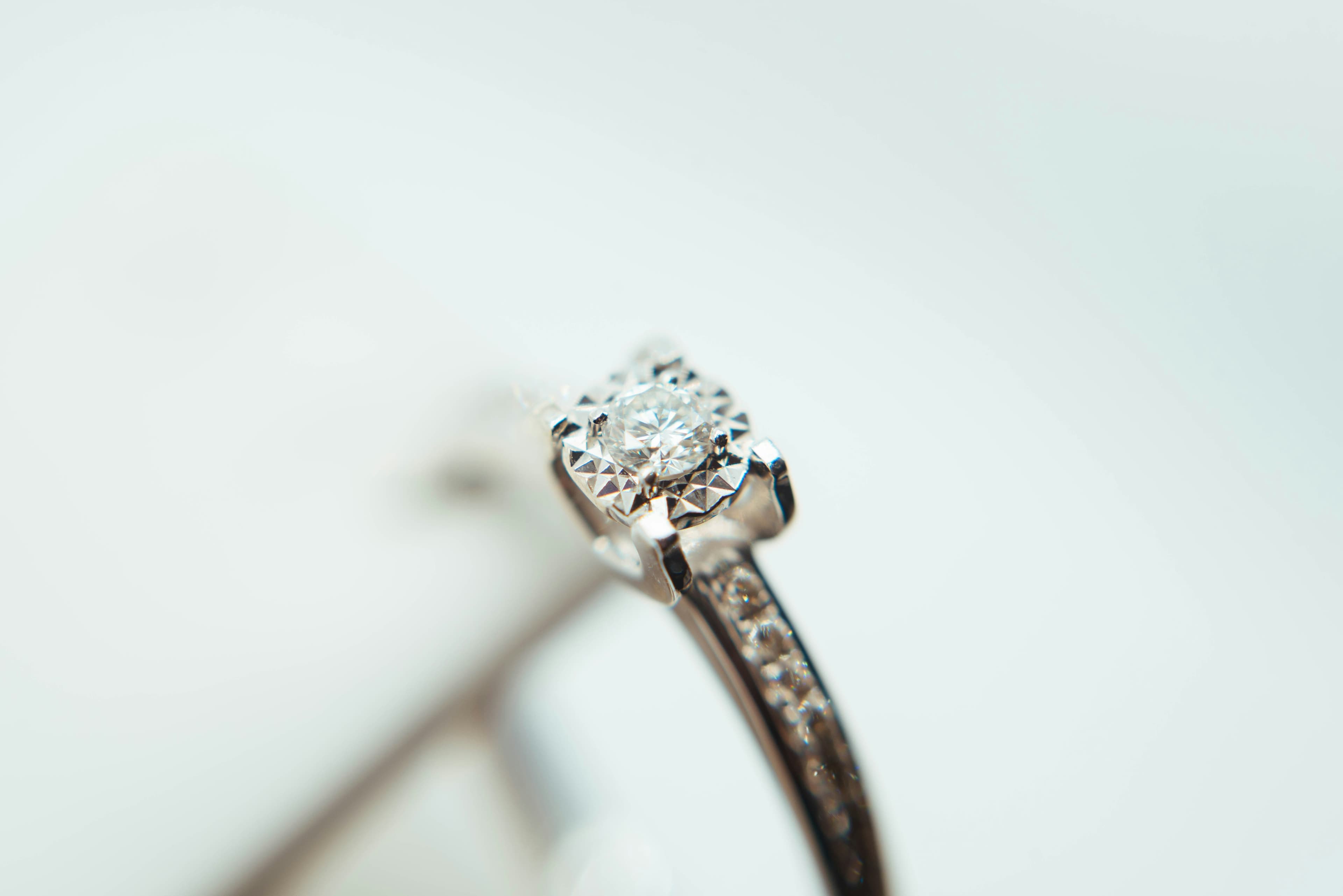 Silver ring set with a faceted gemstone.